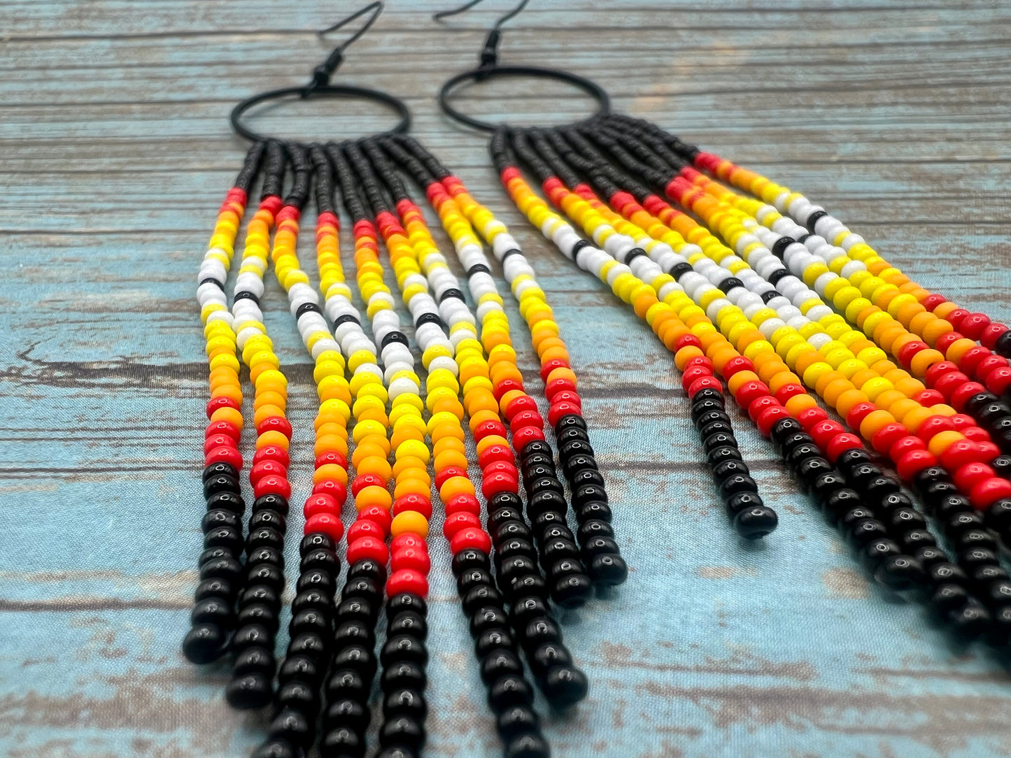 Black beaded fringe hoop and red ombré dangle earrings