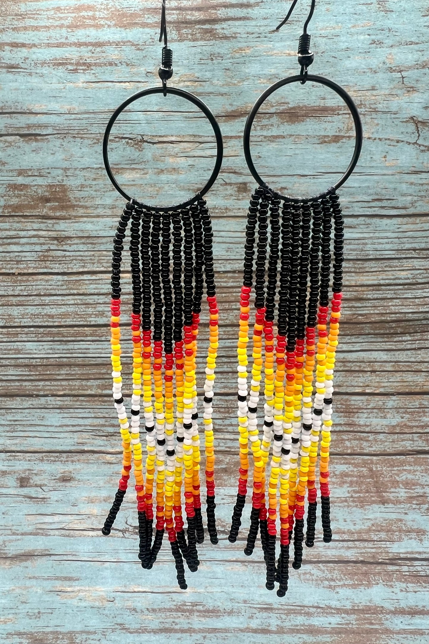 Black beaded fringe hoop and red ombré dangle earrings