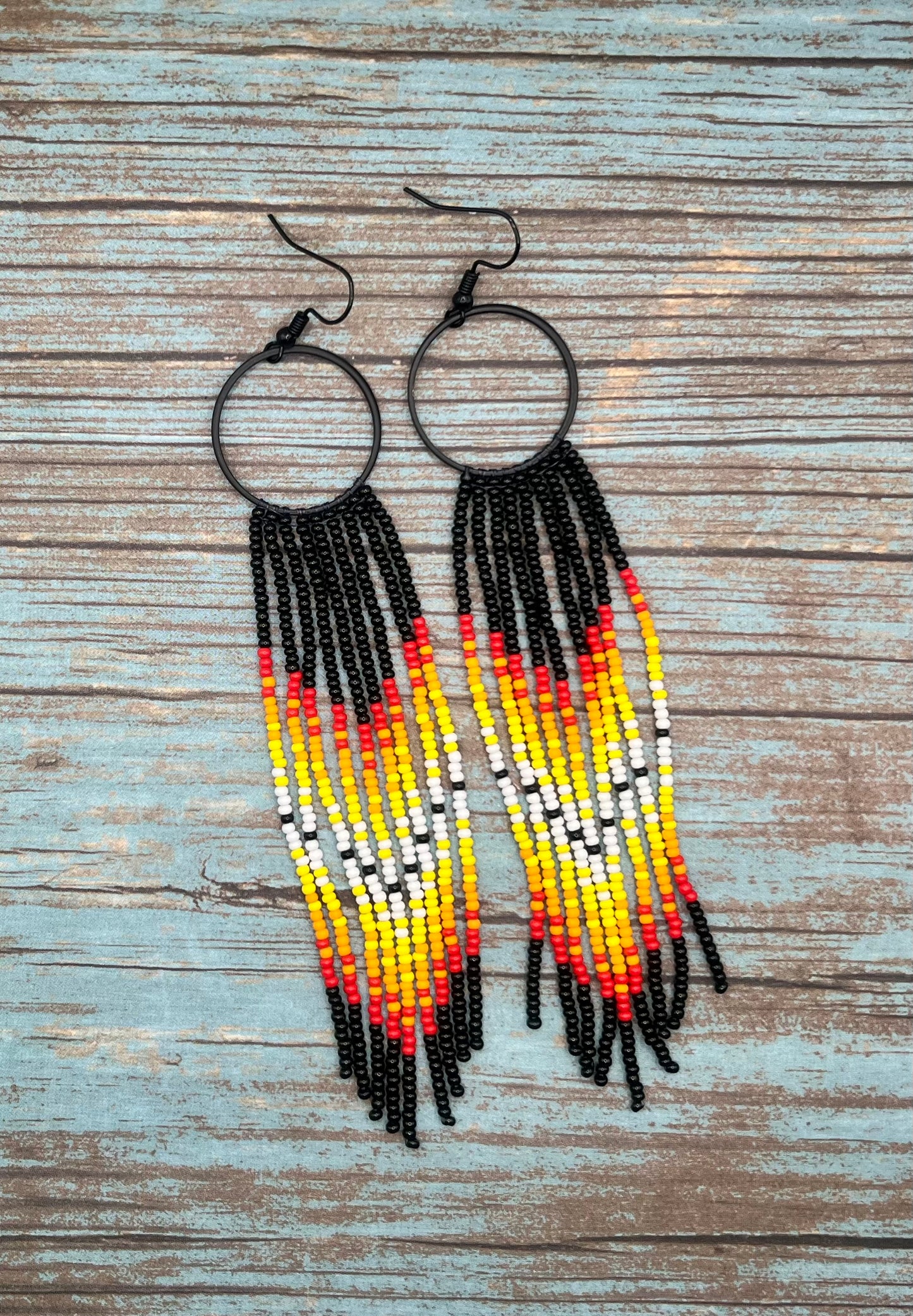 Black beaded fringe hoop and red ombré dangle earrings
