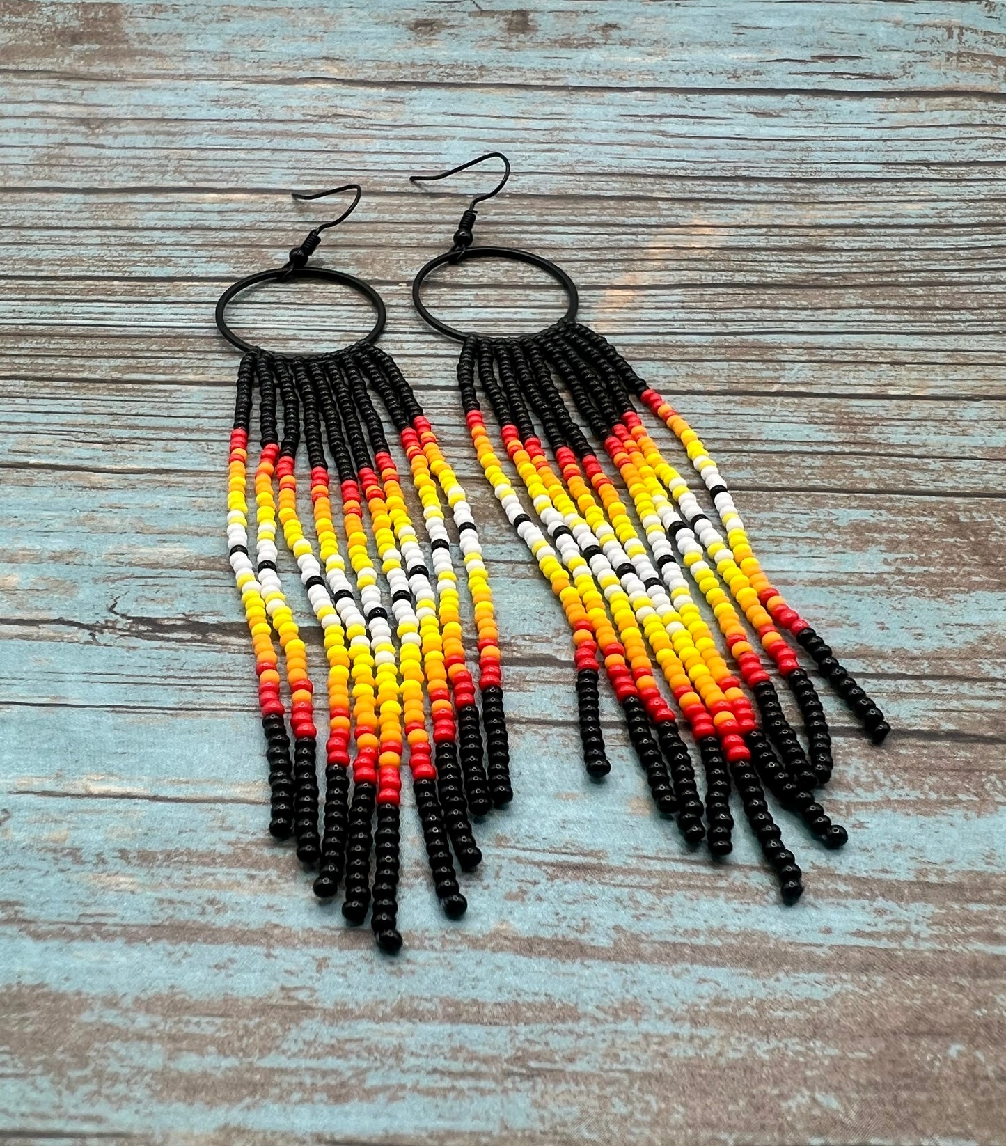 Black beaded fringe hoop and red ombré dangle earrings